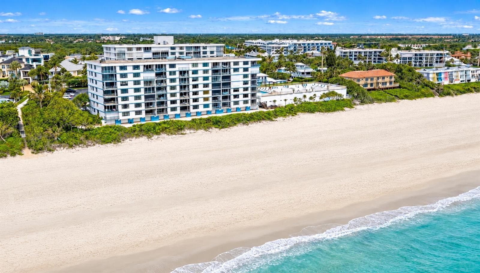 Aerial beachfront condo by turquoise wat