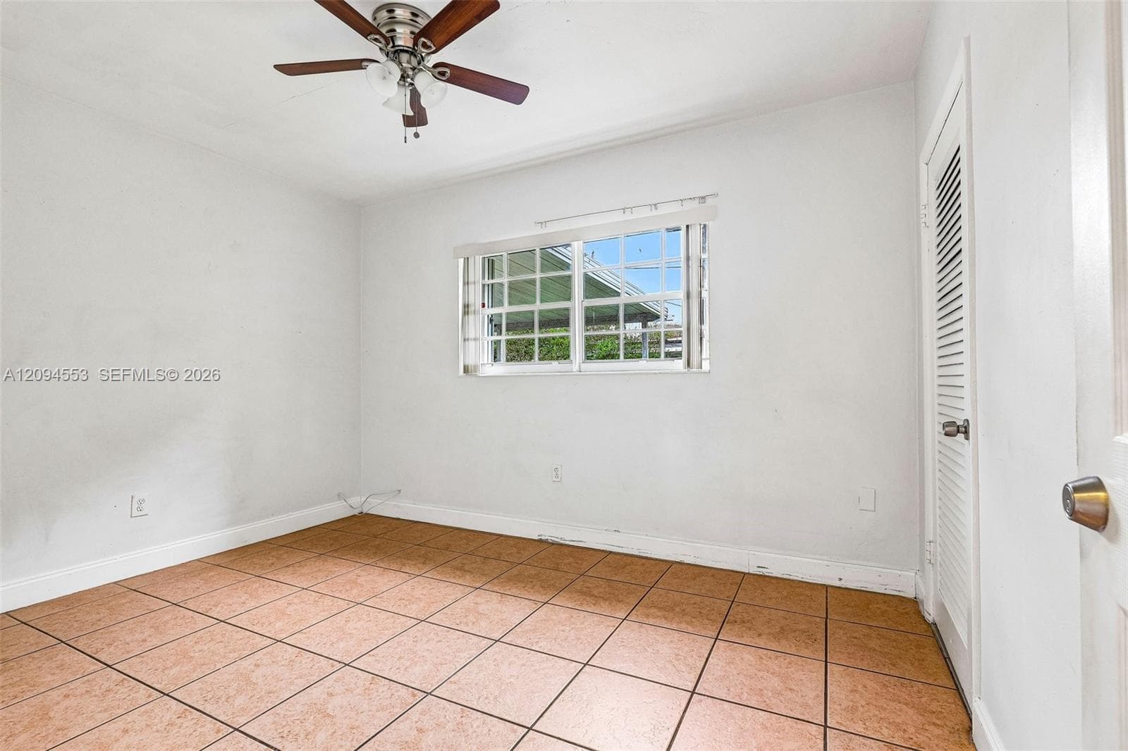 Third bedroom with ceiling fan