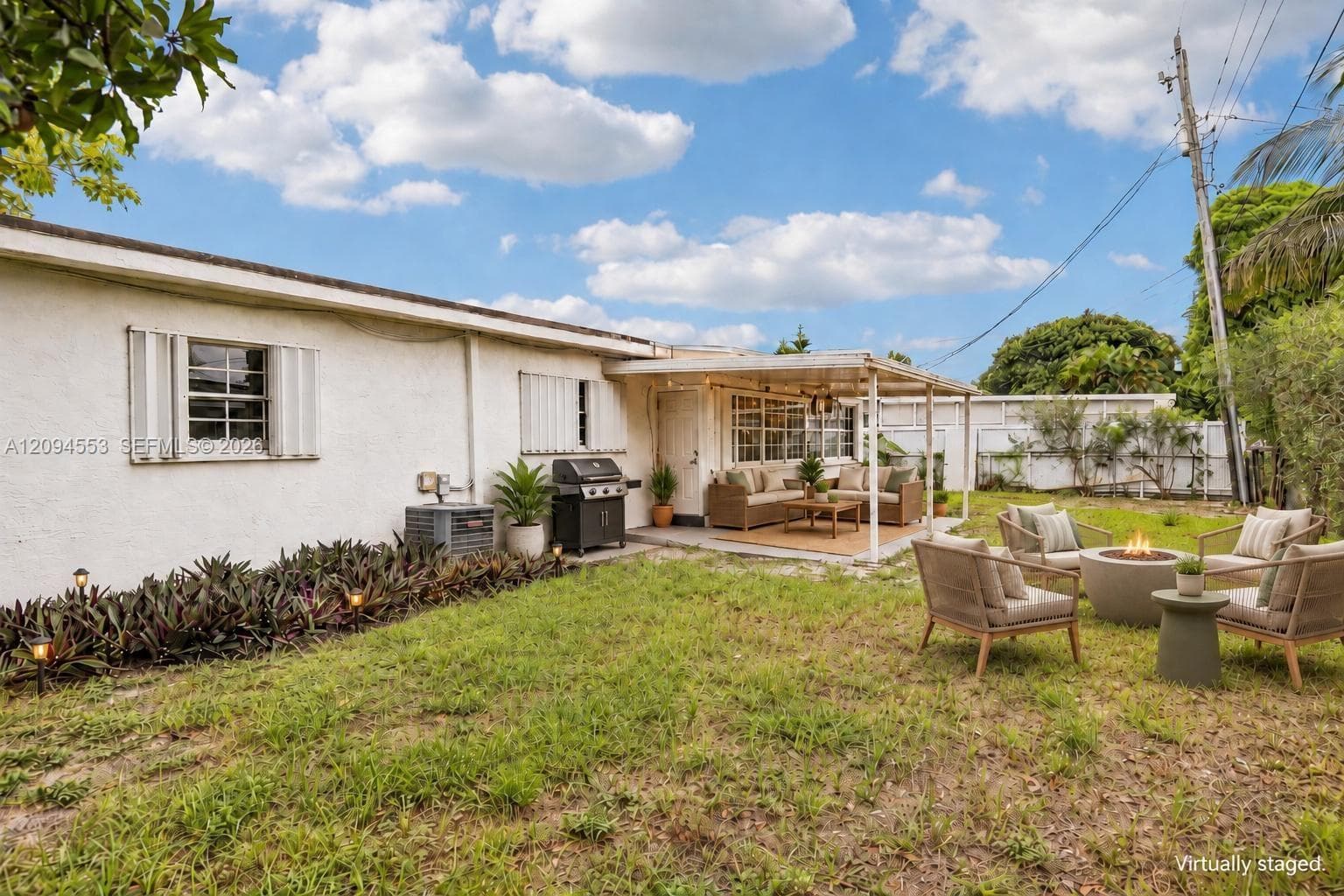 Virtually staged: backyard with covered patio