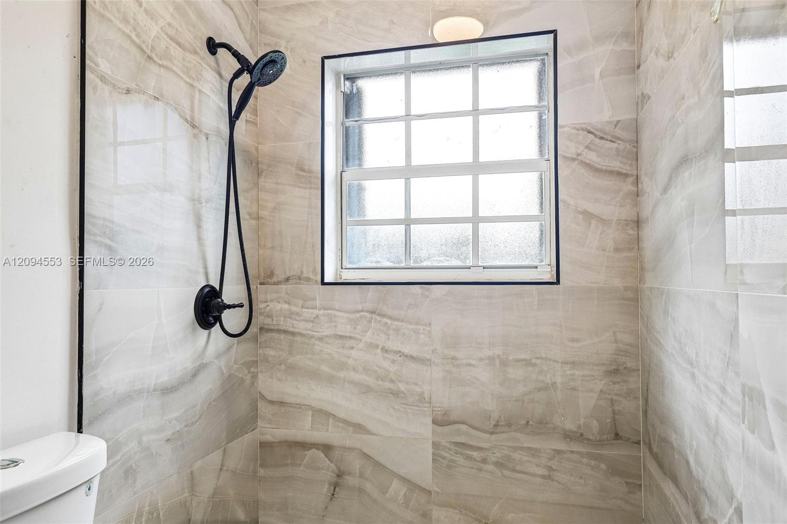 Walk-in shower with large-format tile