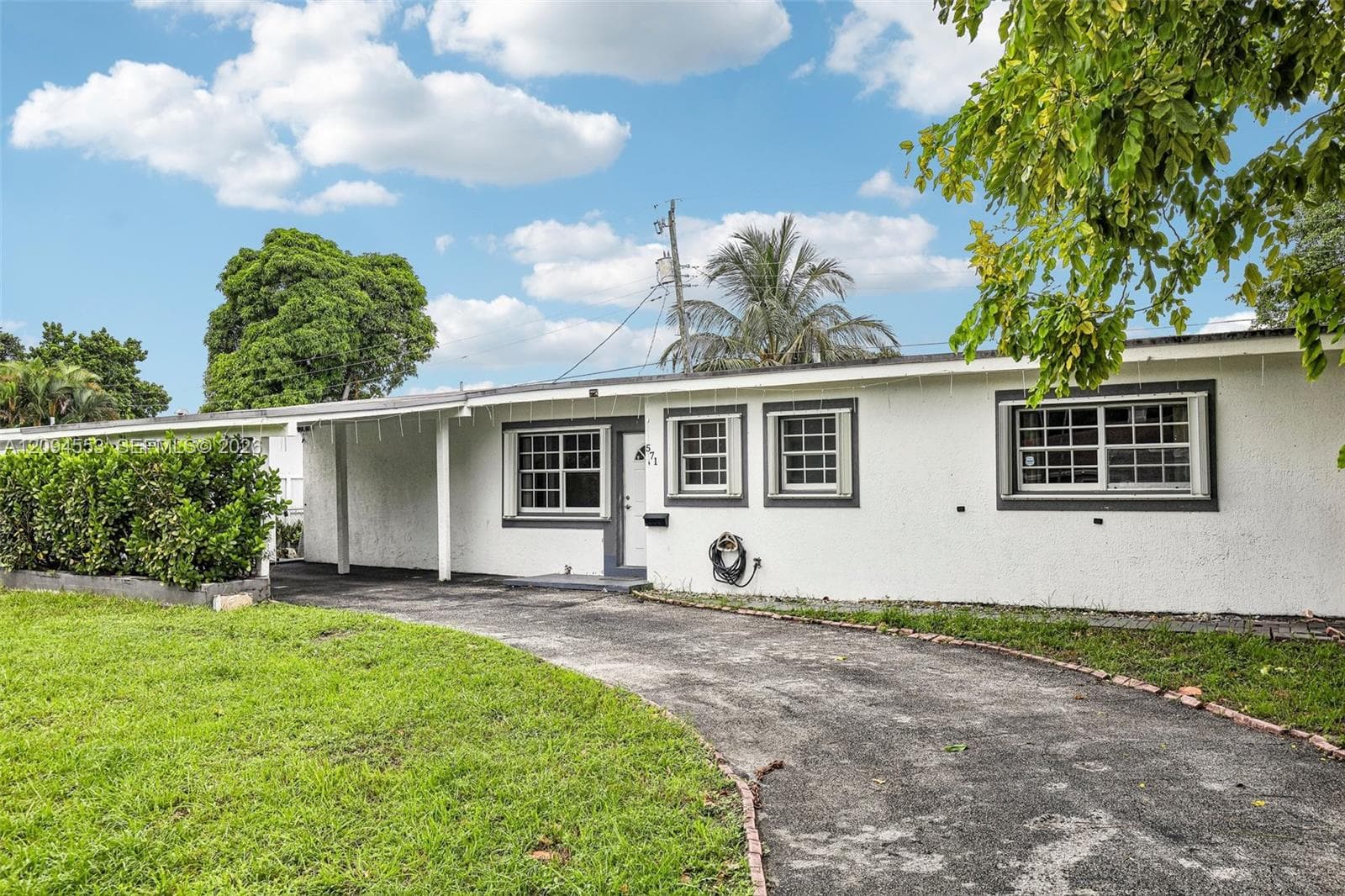 Circular driveway leading to the carport