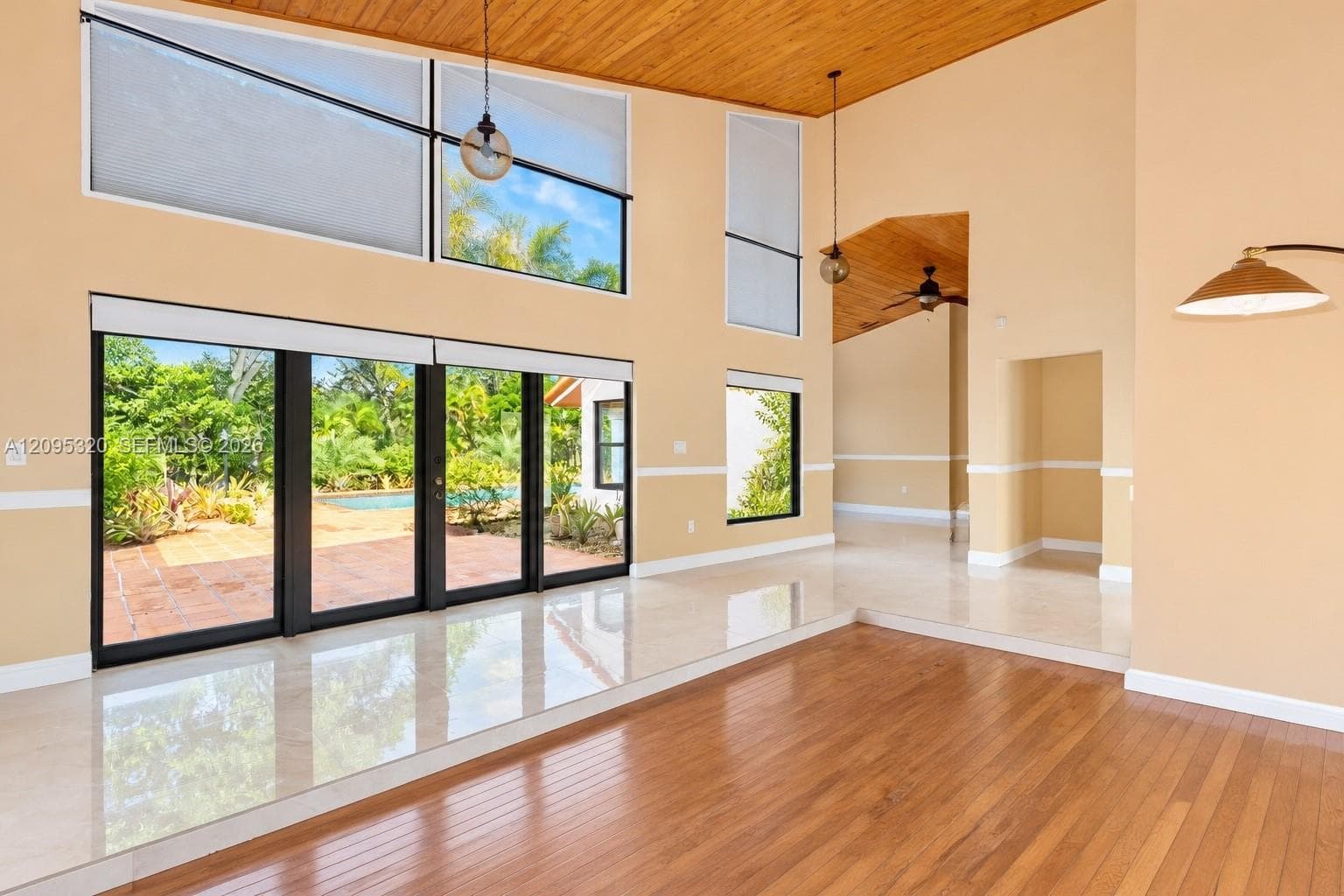 Soaring ceilings with wood-paneled accents
