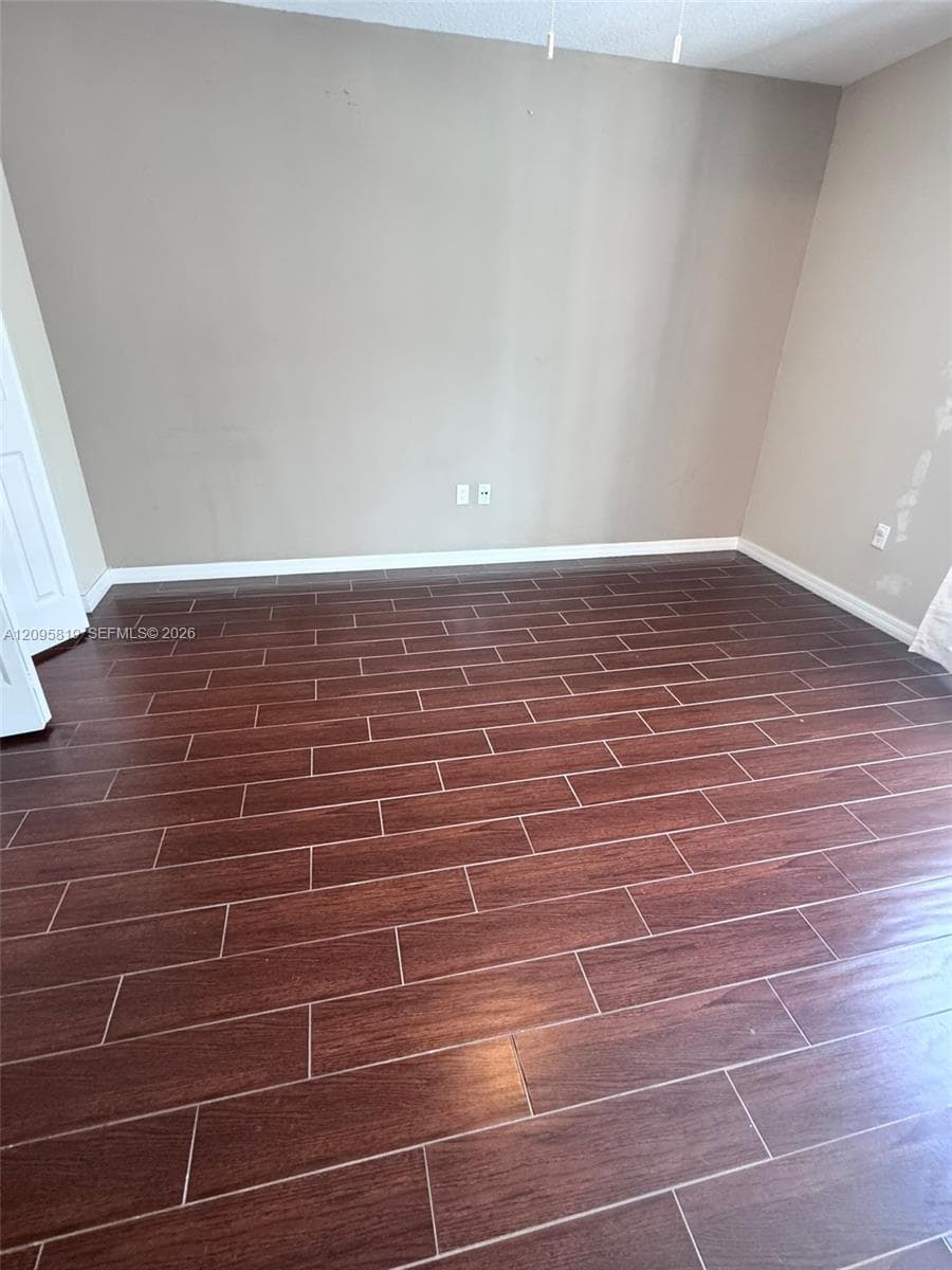 Wood-finish tile flooring in a rectangular plank pattern
