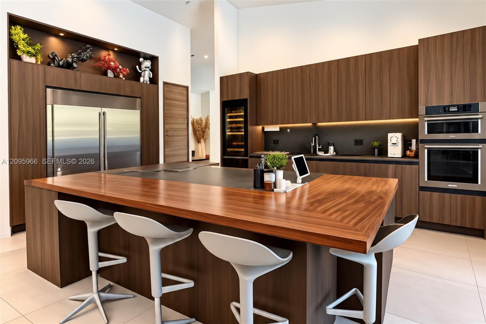 Modern kitchen featuring custom wood-finish cabinetry, a large central island with a wood-grain countertop, integrated stainless steel appliances, a built-in wine refrigerator, and under-cabinet lighting