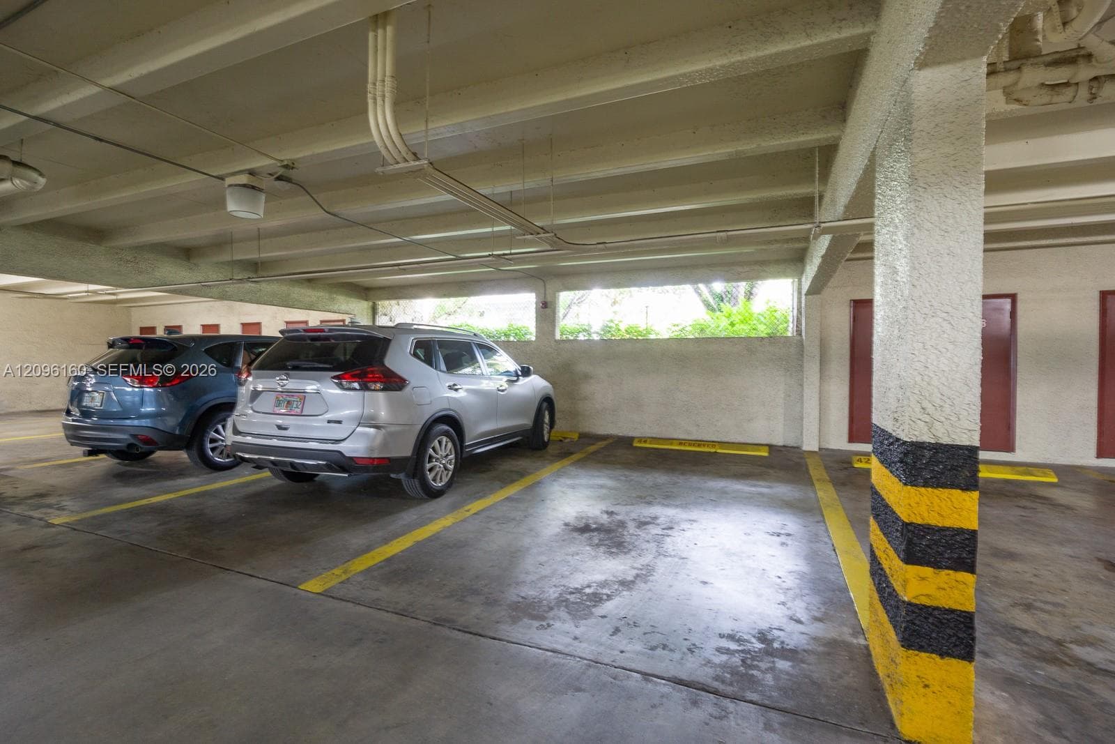 3 Covered Assigned parking Spots