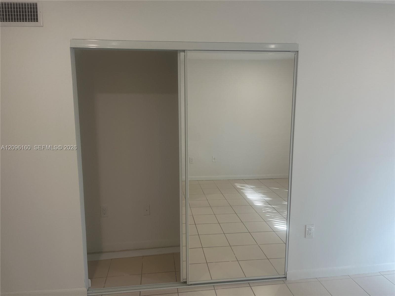 2nd bedroom mirrored closet