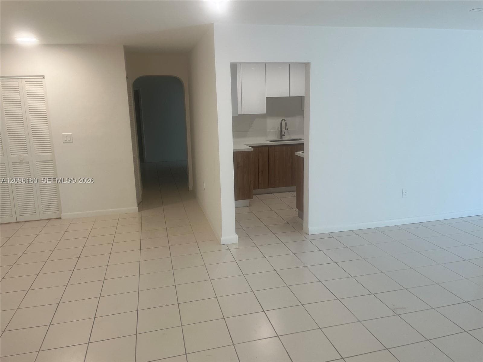 Totally tiled spacious Living Room area