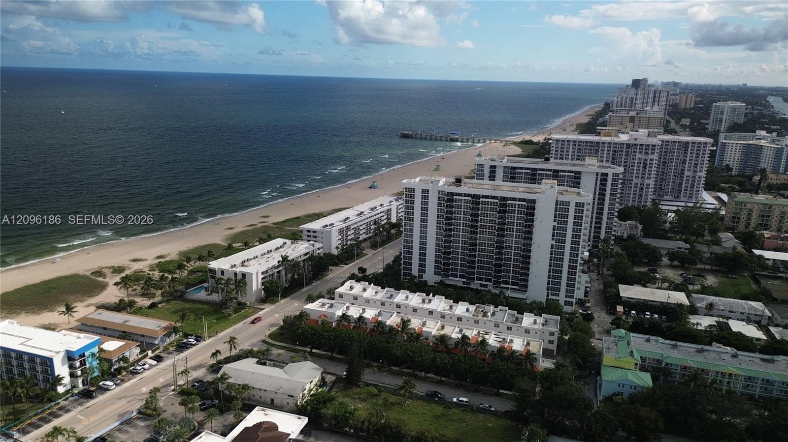 Coastal high-rise residential setting featuring proximity to the Atlantic shoreline, sandy beaches, and expansive ocean frontage