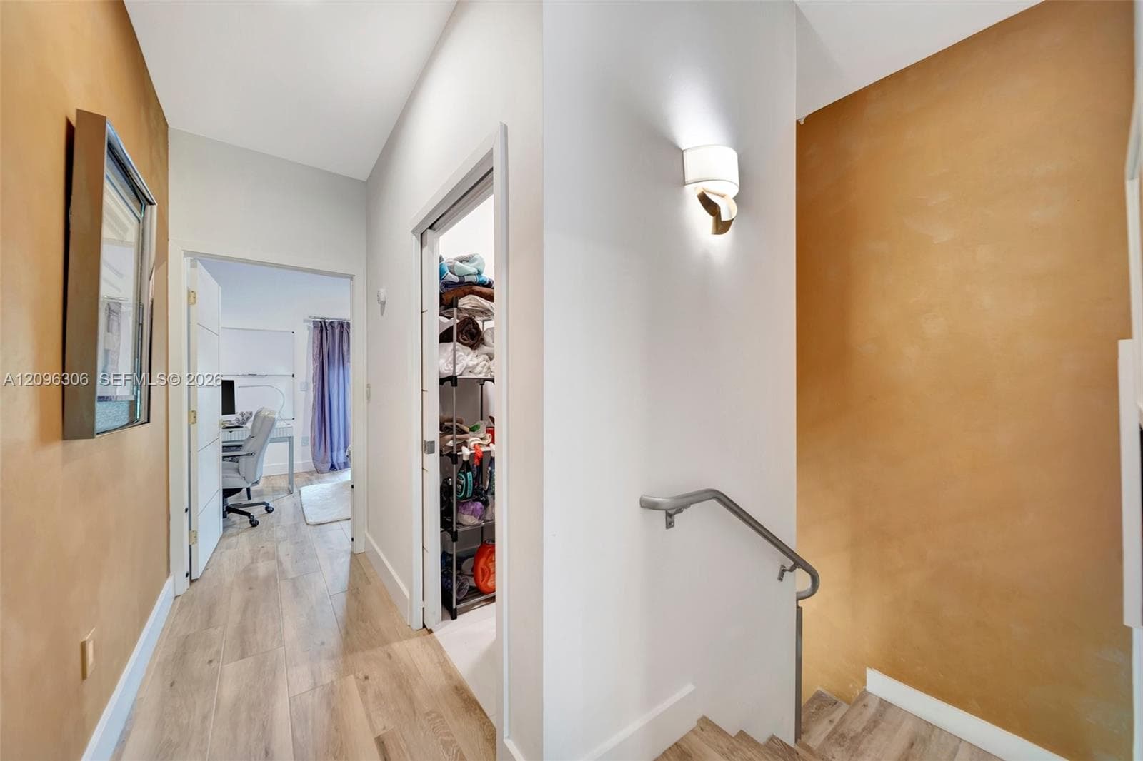 2nd Floor hallway with entry to storage/laundry facility