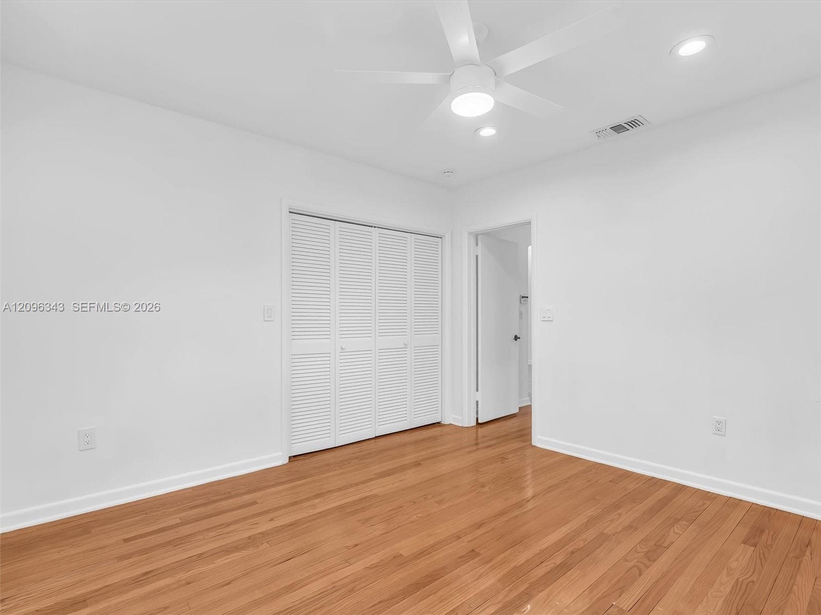 Rear bedroom with double closet.