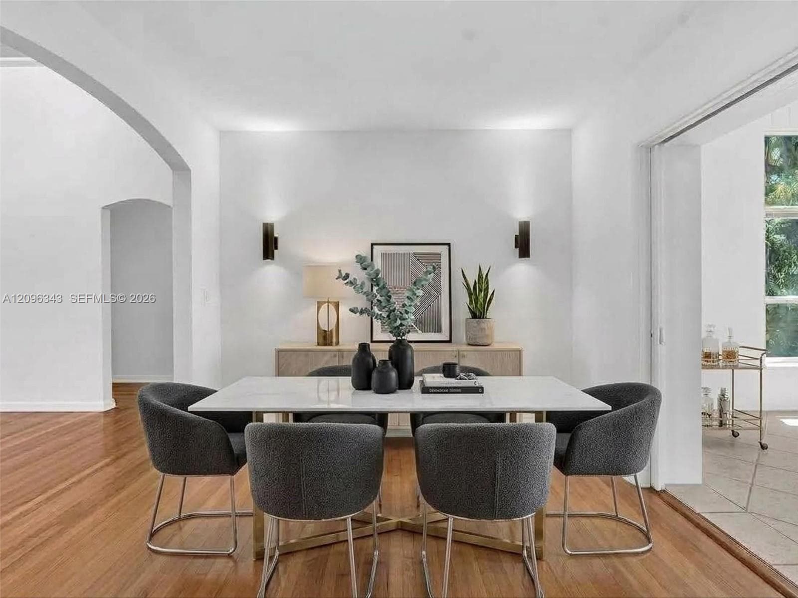 Virtually Staged.  Cute and modern dining room in home for rent in Coconut Grove in Miami, FL. Enjoy this updated home in the North Grove.  Natoma Manors has 24/7 police patrol. Home for rent by Realtor. https://www.natomamanors.com/