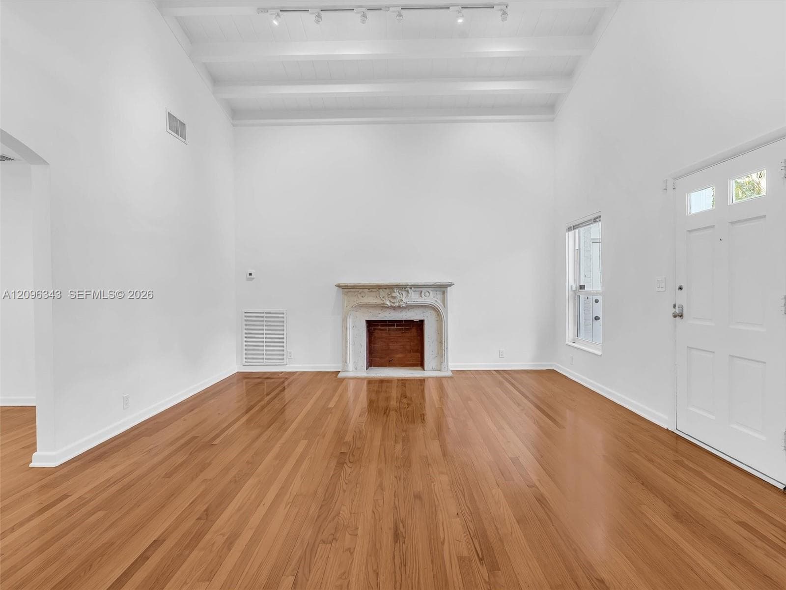 Awesome living room with high ceilings and exposed beams. Great home for rent in Coconut Grove in Miami, FL. Enjoy large fenced yard, updated home in the North Grove.  Natoma Manors has 24/7 police patrol. Home for rent by Realtor. https://www.natomamanors.com/