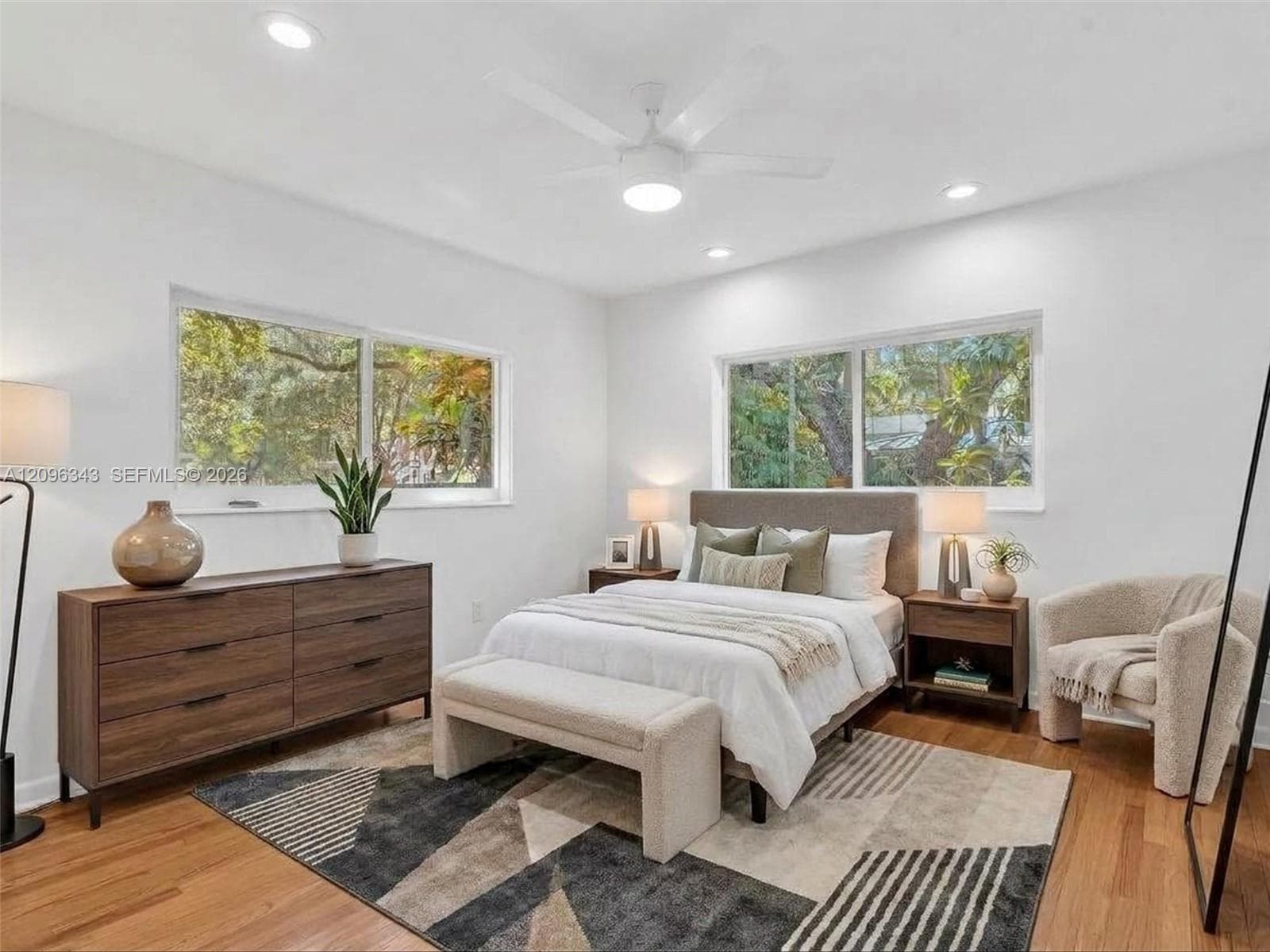 VIRTUALLY STAGED.  Sunny and private back bedroom overlooking gated yard with double closet.  House for rent in Coconut Grove.