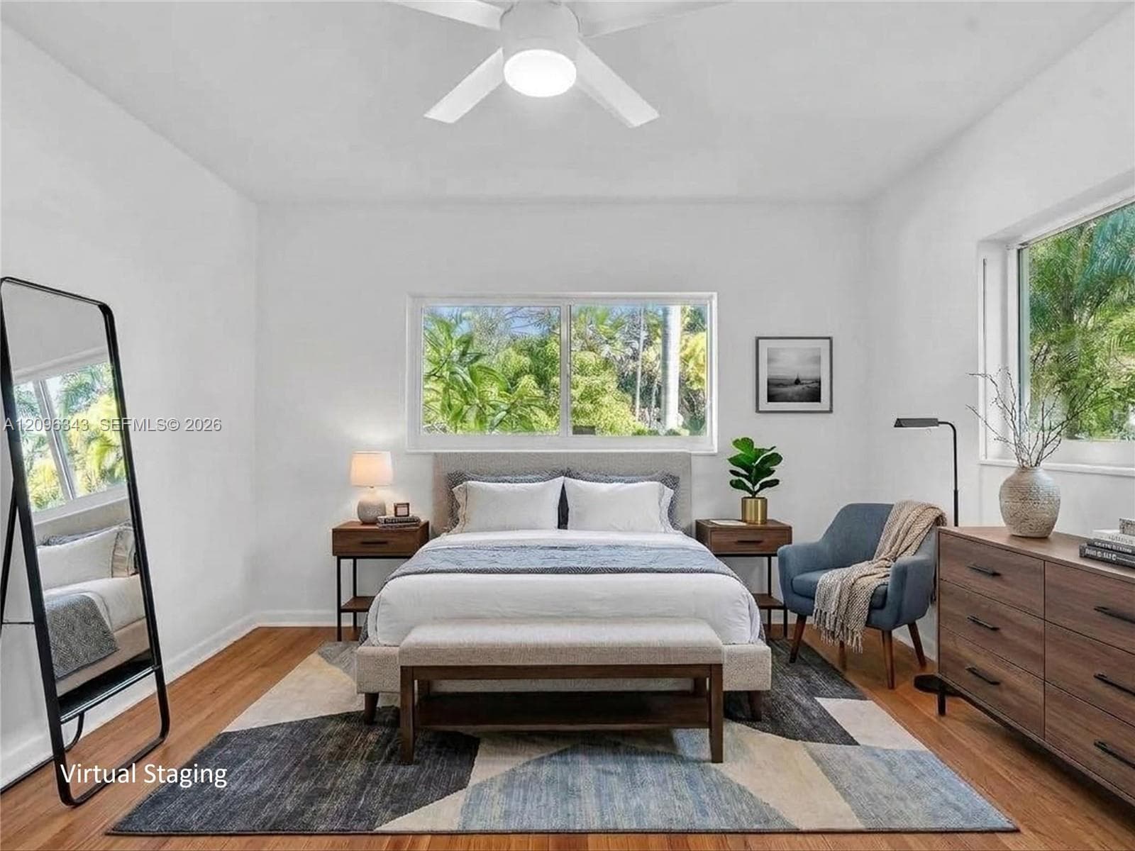 VIRTUALLY STAGED. Front bedroom with bright sunny windows, hard wood floors, and large closet in this home for rent in Coconut Grove in Miami, FL. Natoma Manors has 24/7 police patrol. Home for rent by Realtor. https://www.natomamanors.com/