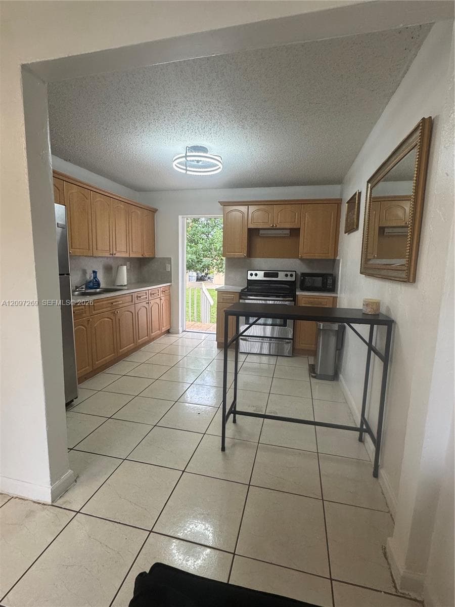 Backdoor with direct access to backyard.