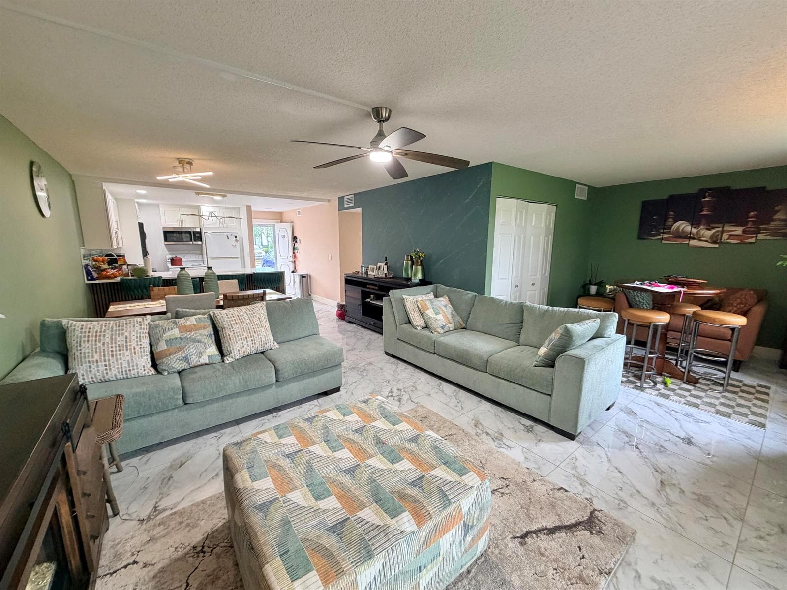 Living room to dining area to kitchen
