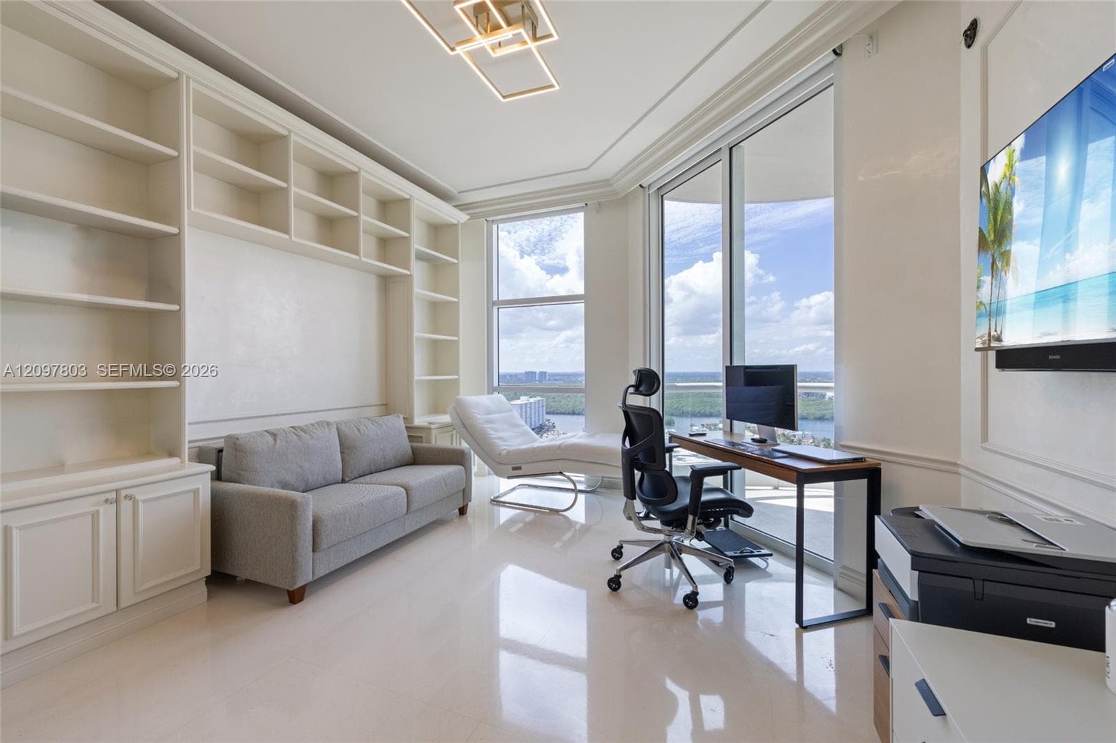 Built-in floor-to-ceiling cabinetry, polished stone flooring, custom wall molding, geometric LED ceiling fixture, and floor-to-ceiling windows