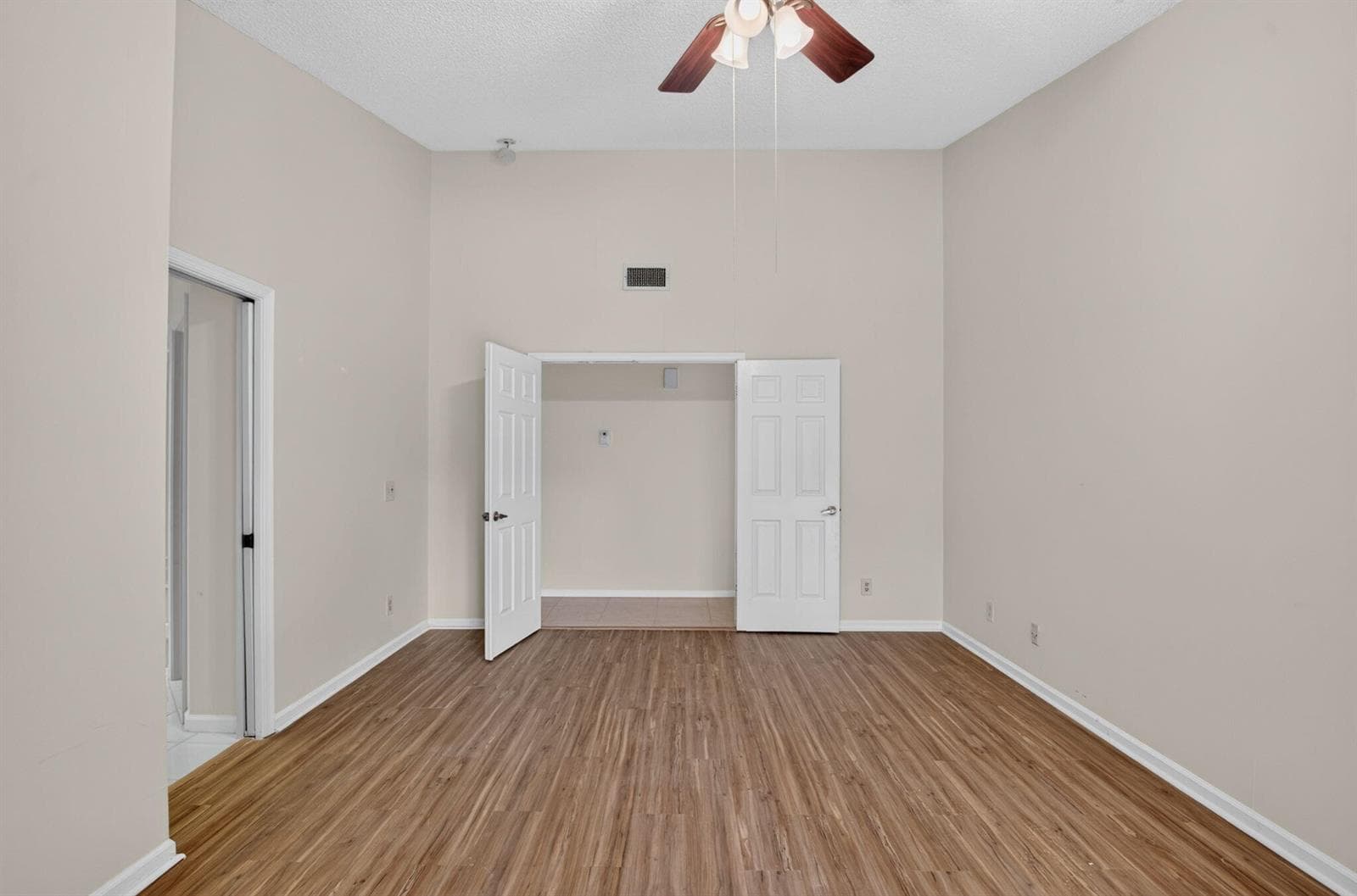 PRIMARY BEDROOM WITH WALK IN CLOSET