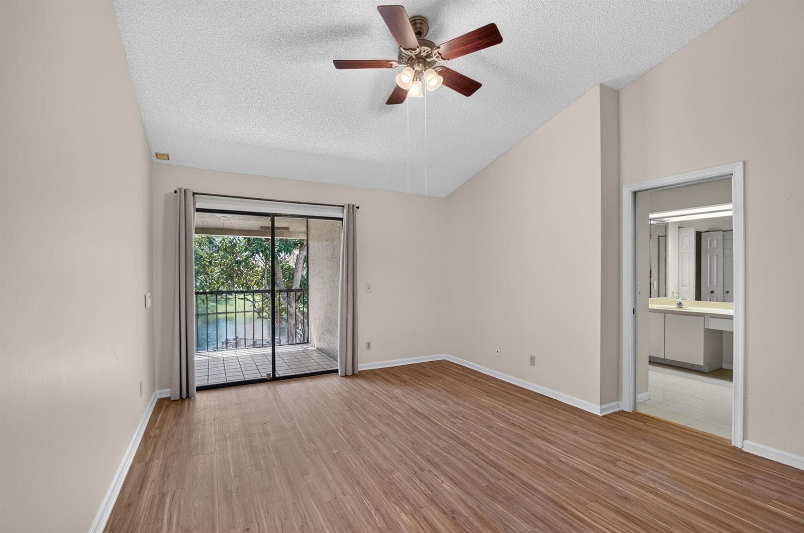 PRIMARY BEDROOM WITH BALCONY ACCESS
