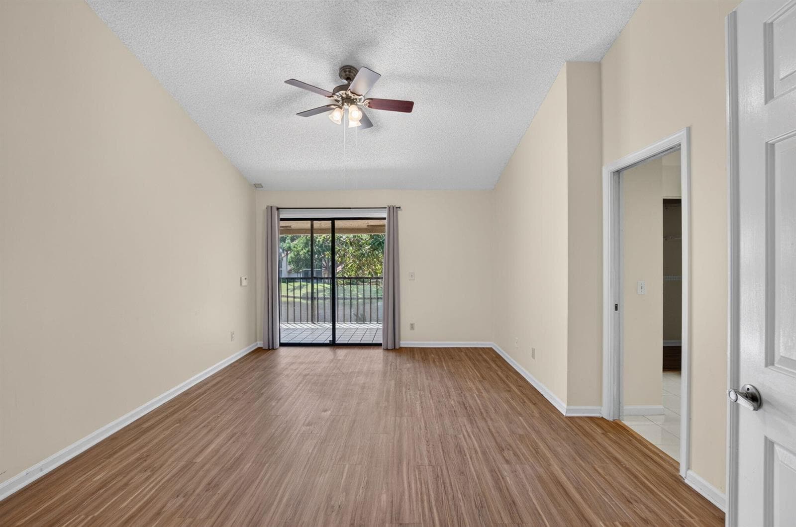 PRIMARY BEDROOM WITH VAULTED CEILINGS