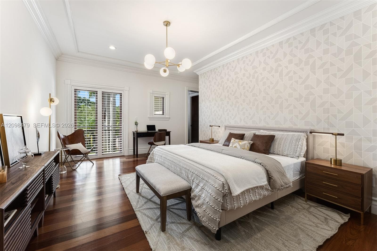 Hardwood flooring, crown molding, double-paned glass sliding doors, recessed lighting, and a modern light fixture