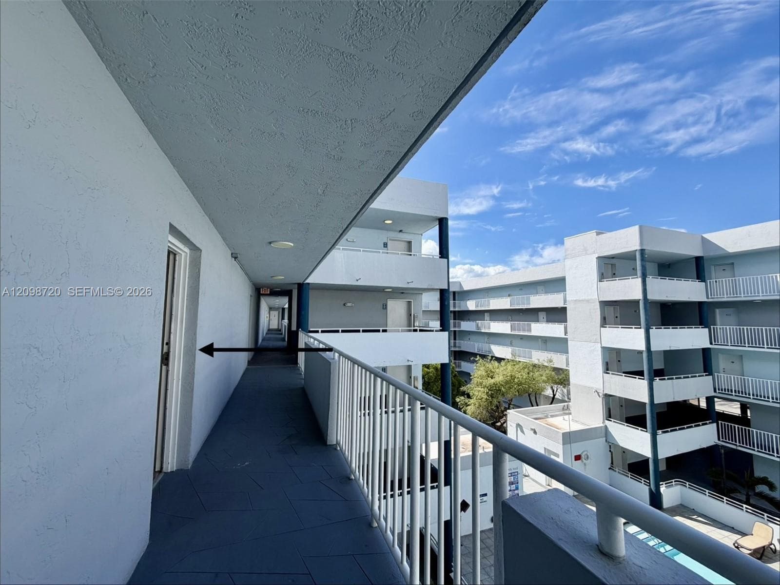 Front door balcony overlooks the pool area