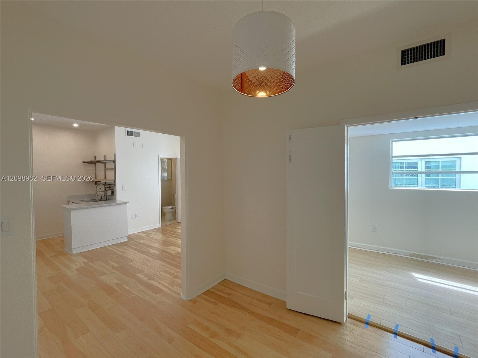 Entry way. Enclosed bedroom on the right
