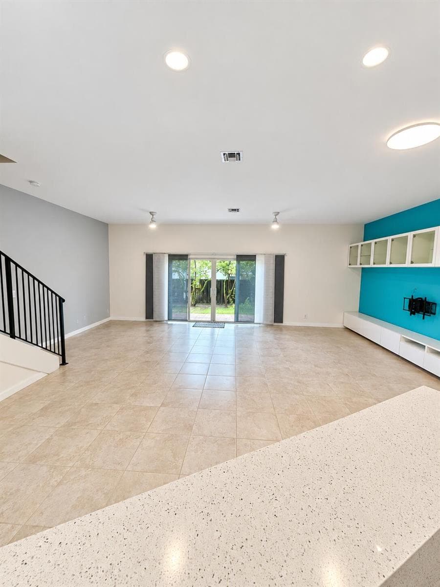 Bright Open-Plan Living Room with Teal A