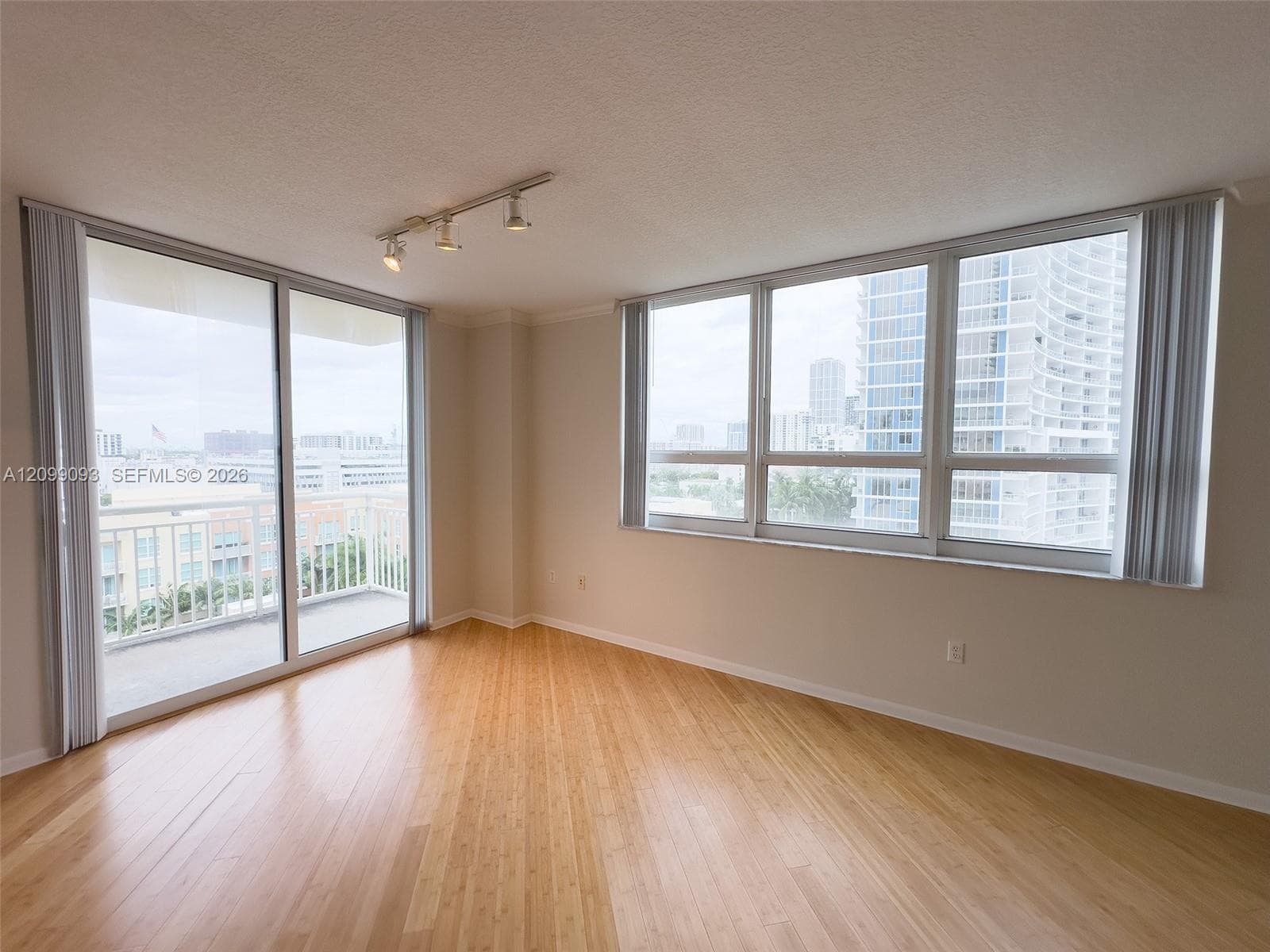 Bright living room with balcony.