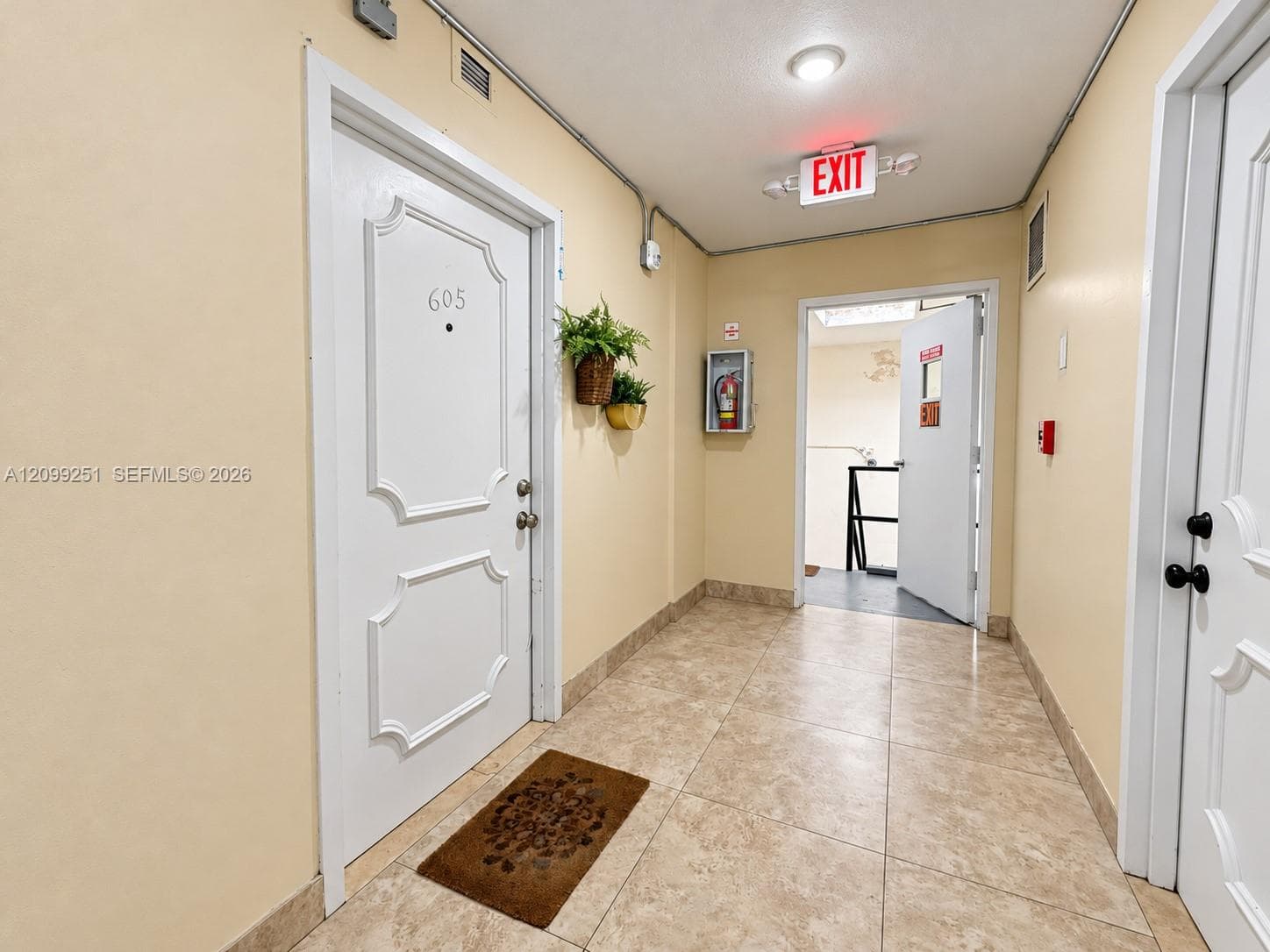 Wall-mounted light fixture, recessed ceiling light, and ceramic tile flooring