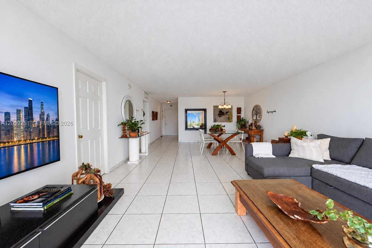 Bright interior with white tile flooring and white walls