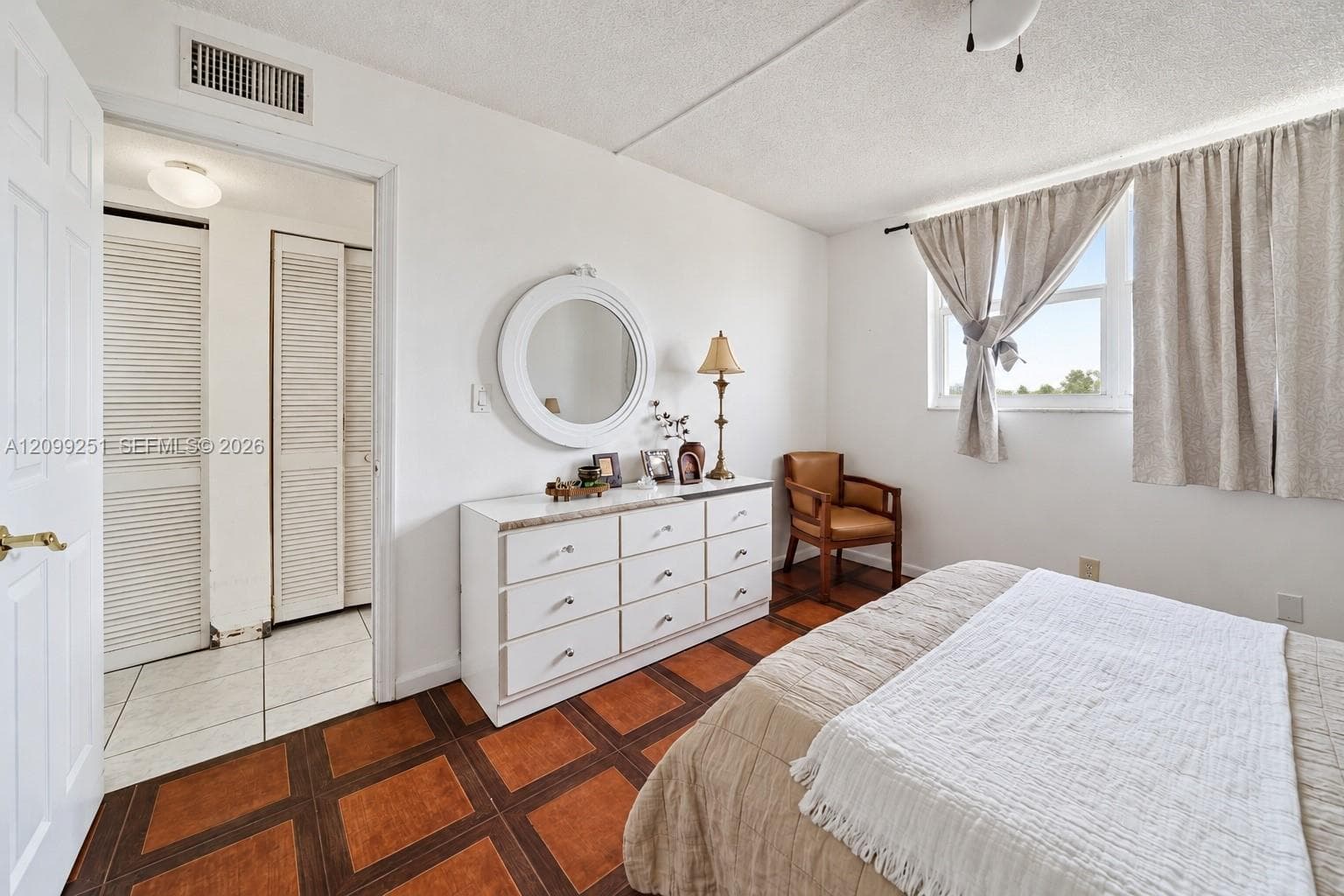 White painted walls and ceiling with a rectangular window