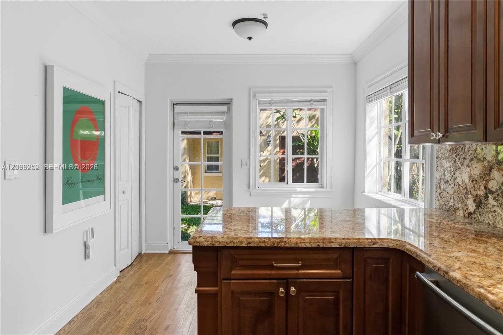 Kitchen offers space for breakfast nook and convenient laundry closet