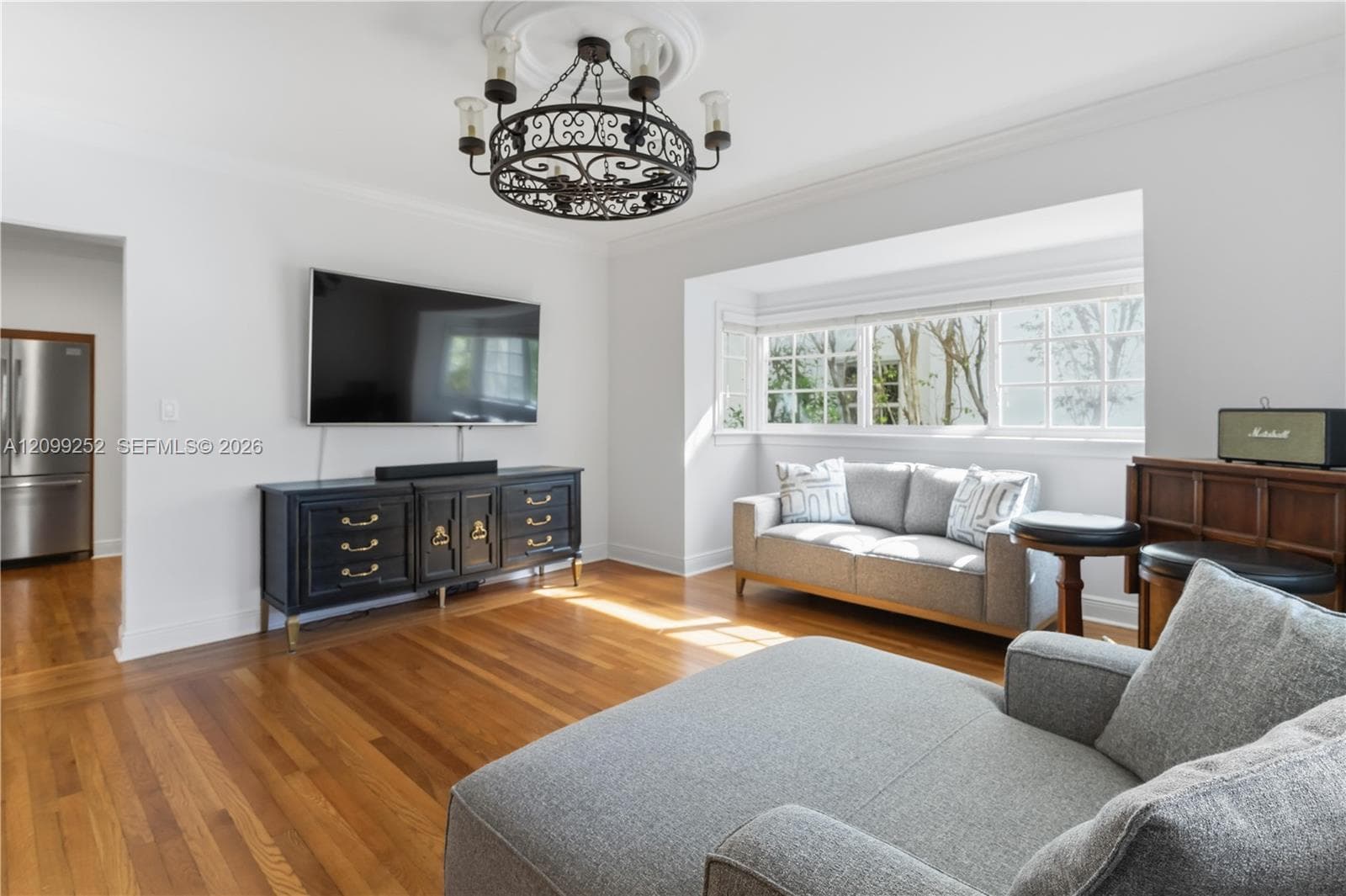 Spacious family room offering flexible space for dining and entertaining.