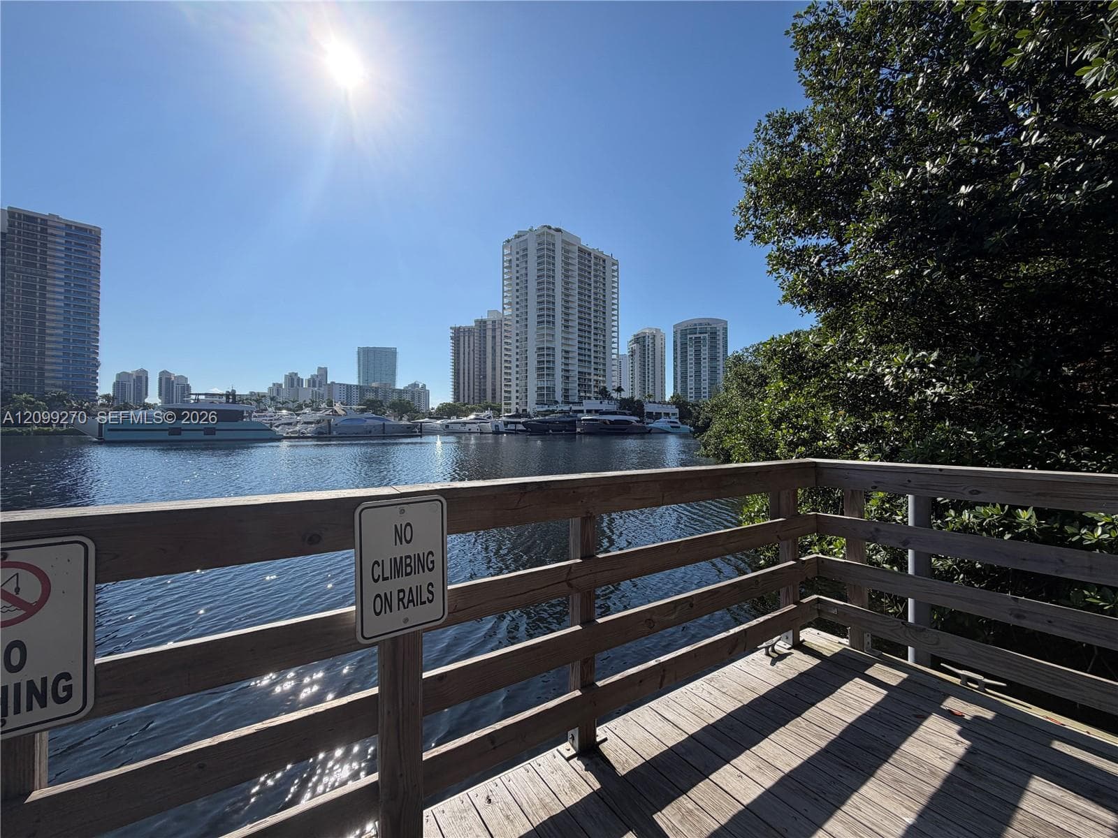 Waterfront wood deck featuring a horizontal railing system