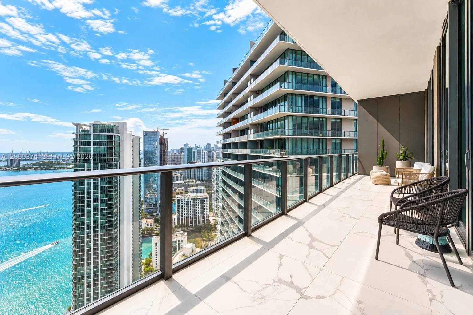 Long private balcony with city and bay views