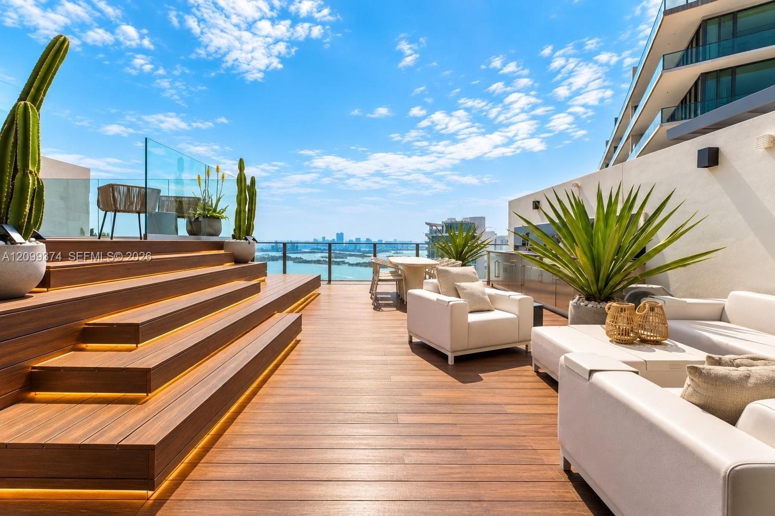 Expansive rooftop lounge with panoramic water views