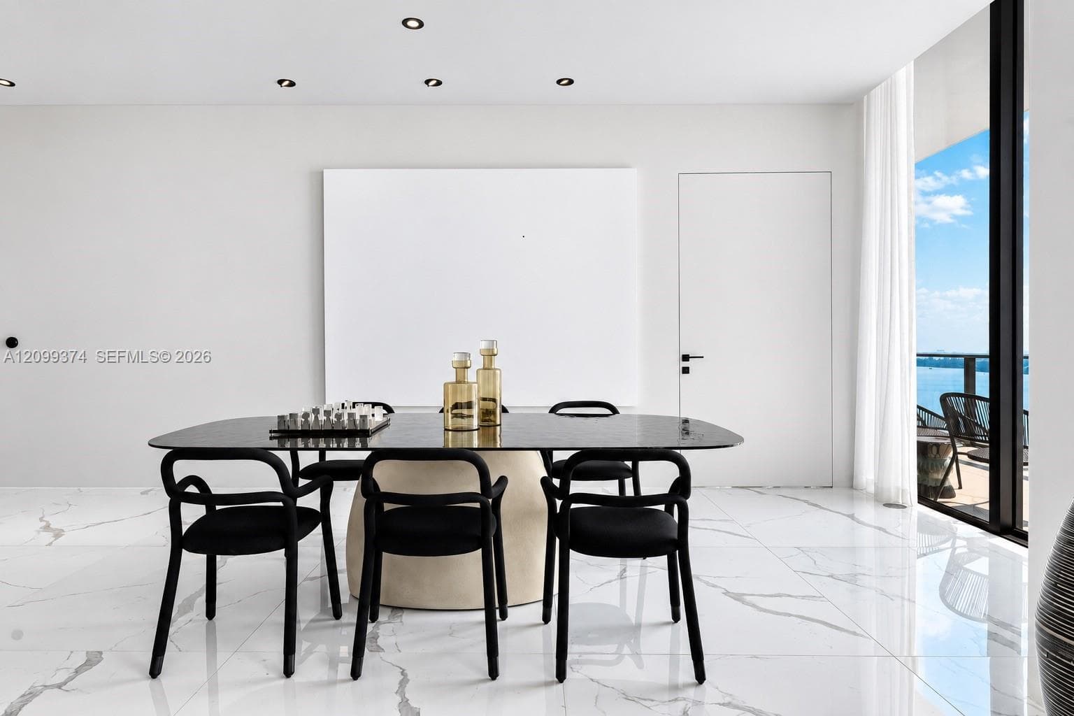 Formal dining area with floor-to-ceiling windows