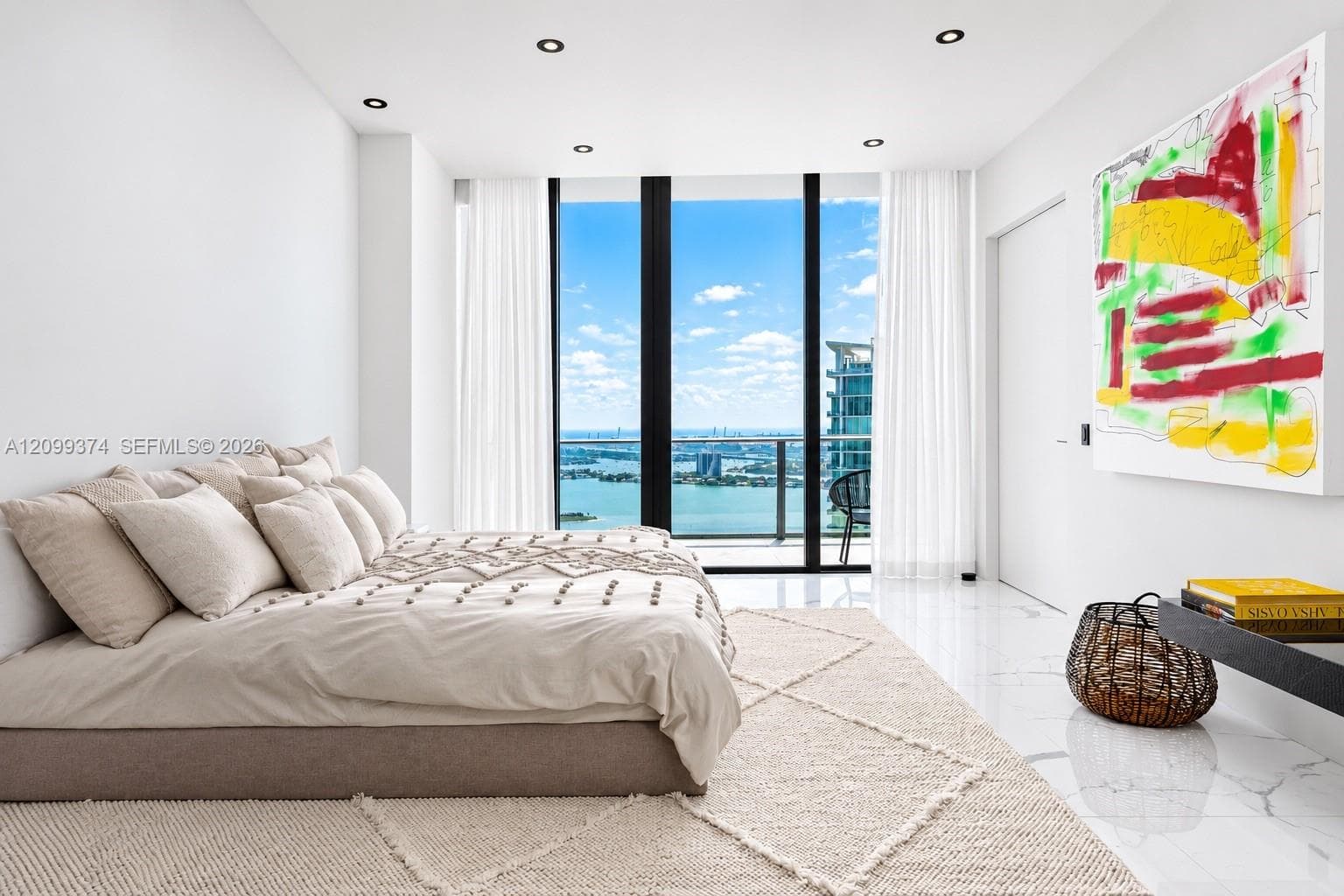 Bedroom with floor-to-ceiling bay views