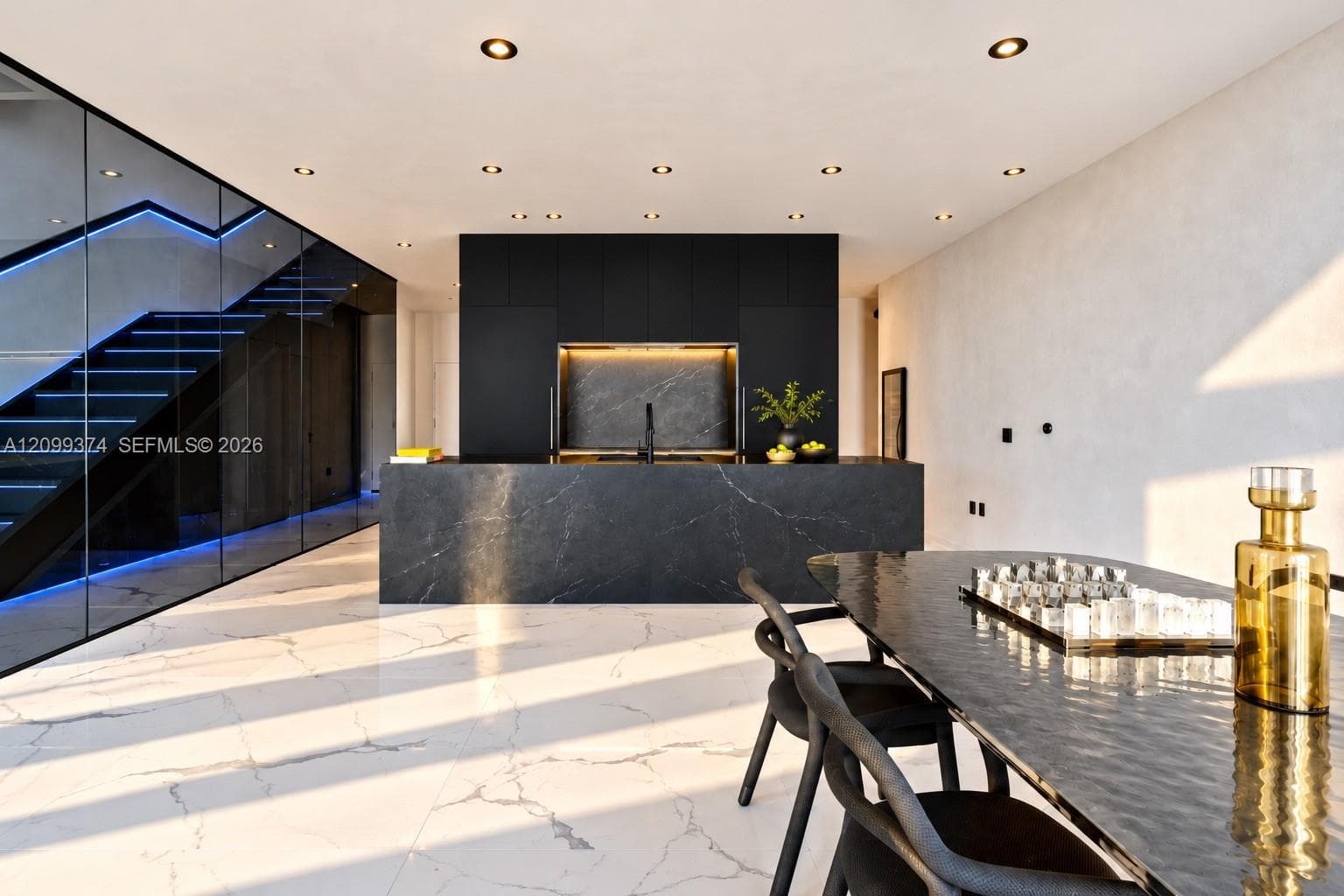 Custom kitchen and dining area illuminated by golden-hour light