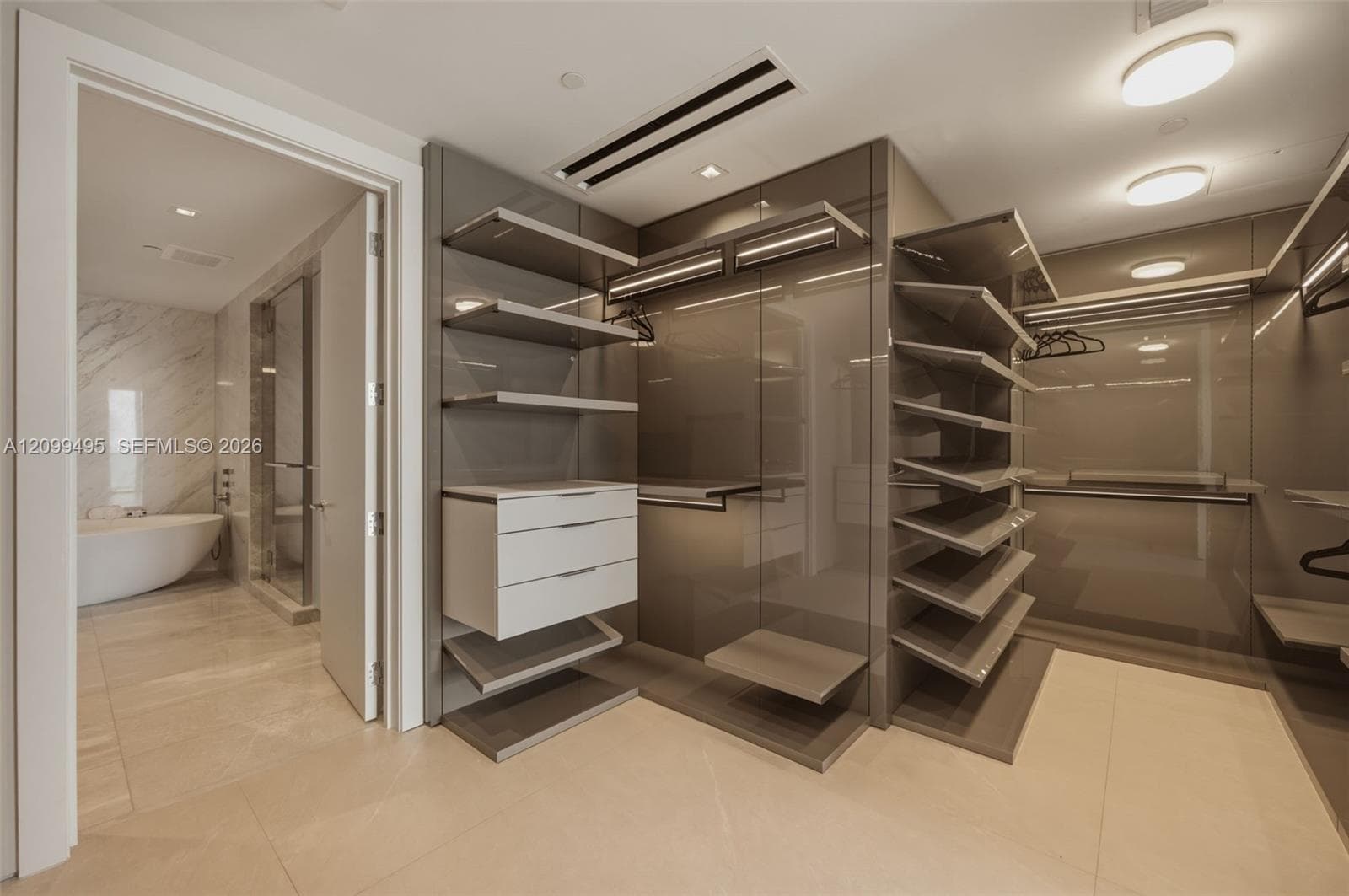 Large custom made walk-in closet.