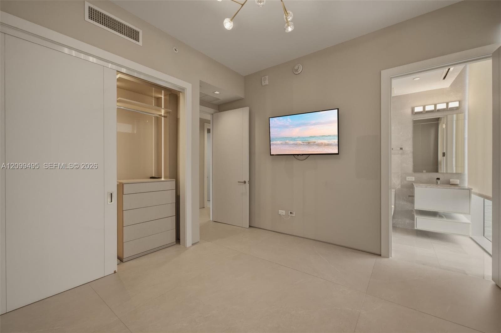 Second en-suite bedroom with custom made lighted closet.