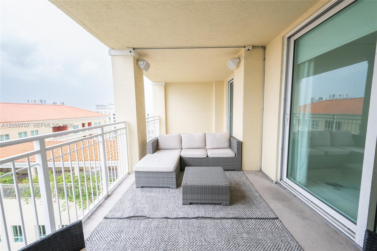large balcony off both the living area and the bedroom