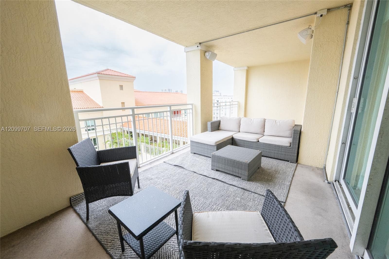 large balcony off both the living area and the bedroom