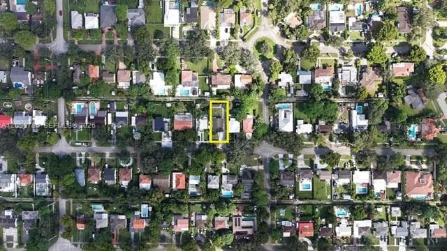 Aerial view of a residential area. The property is highlighted within the urban landscape