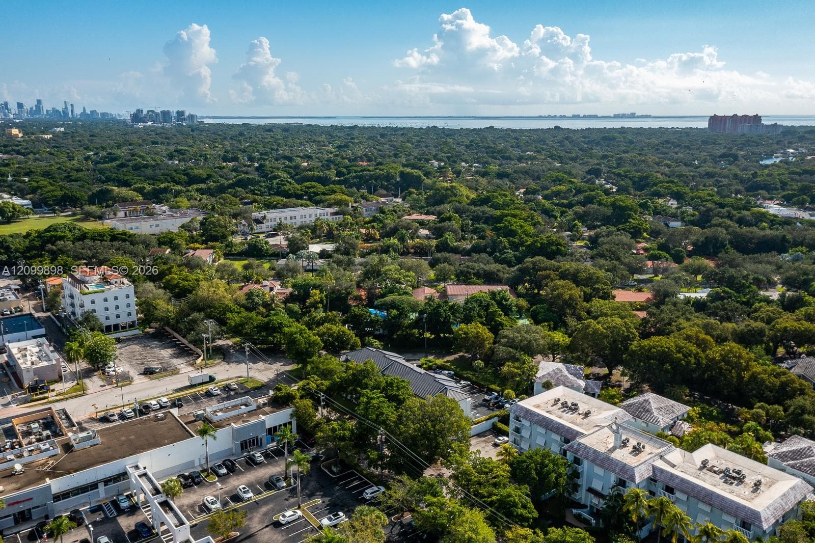 Once again, looking Easterly and seeing Downtown Miami, the Brickell area and also Downtown Coconut Grove and beyond Biscayne Bay you can see the Key Biscayne Island where you have Crandon Beach & my favorite, Cape Florida State Park, where the oldest light house is situated in Miami-Dade County, both are BEACH sites  that have the cleanest & nicest beaches, South of Miami Beach!!