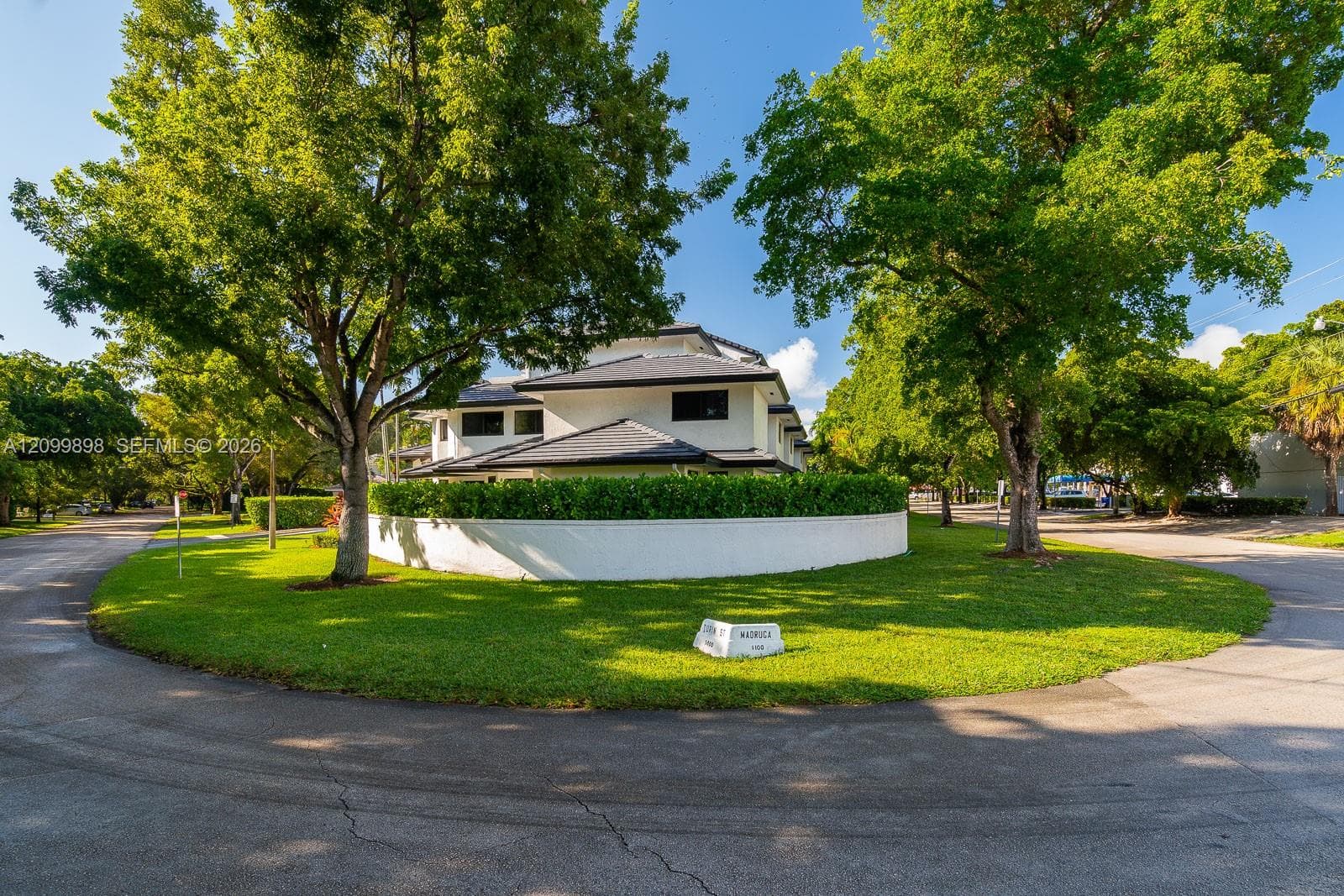 To the right is Madruga St and to the left is Turin Street which has the entrance to the buildings parking Lot!  This is a 2 story, 2Bdrm/2.5 Bath Townhouse with over over 990 SF!