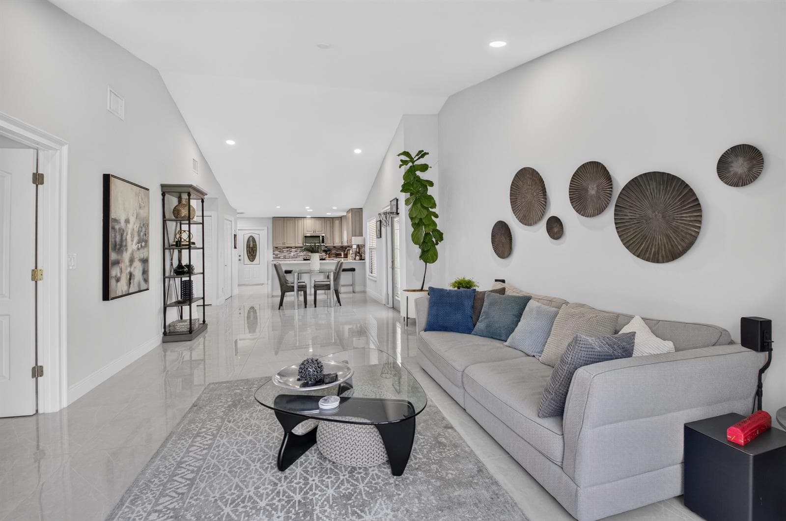 Living room facing dining and kitchen