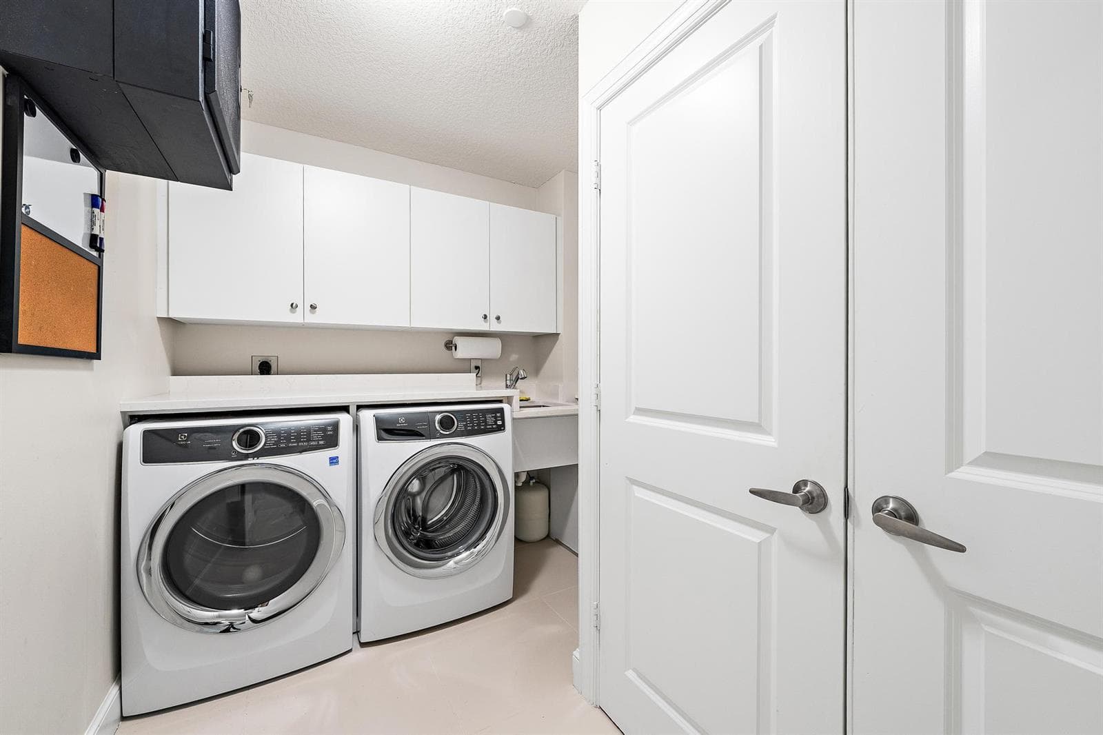 Large laundry room with sink