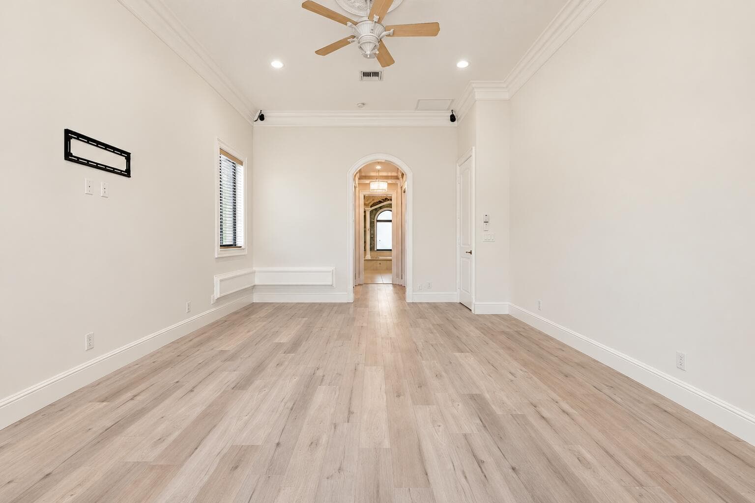 Warm White Room with Arched Hallway